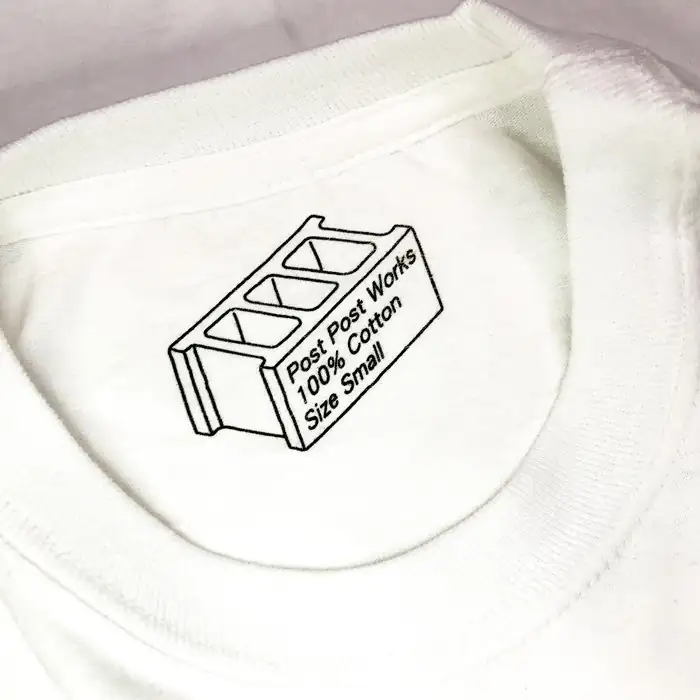 Post Post Works printed neck tag: a cinder block drawing with 100% Cotton and Size Small inside it